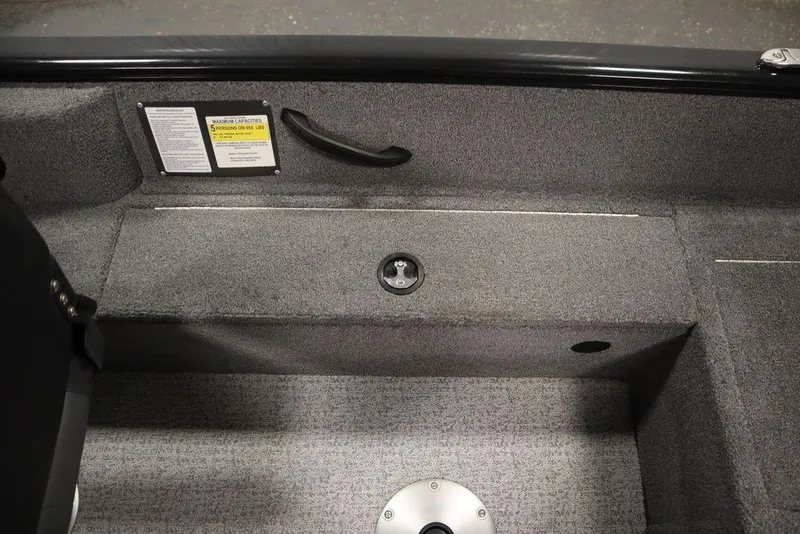 Slide: The Image of 2023 Tracker Pro Guide V-16 WT interior with gray carpet and seating area. - 43