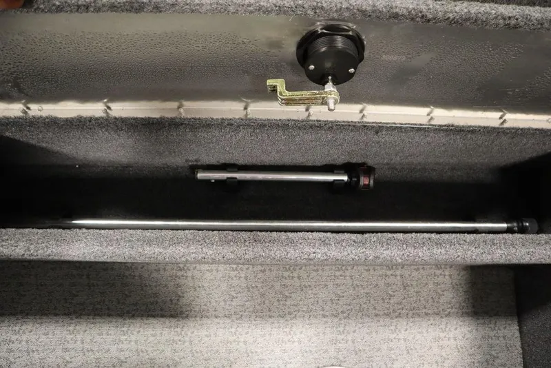 Slide: The Image of 2023 Tracker Pro Guide V-16 WT storage compartment with rod holder and latch. - 44