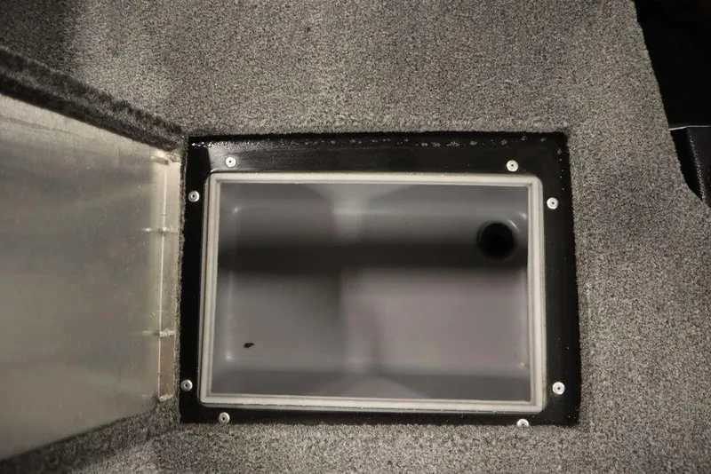 Slide: The Image of 2023 Tracker Pro Guide V-16 WT boat storage compartment with carpeted interior. - 46