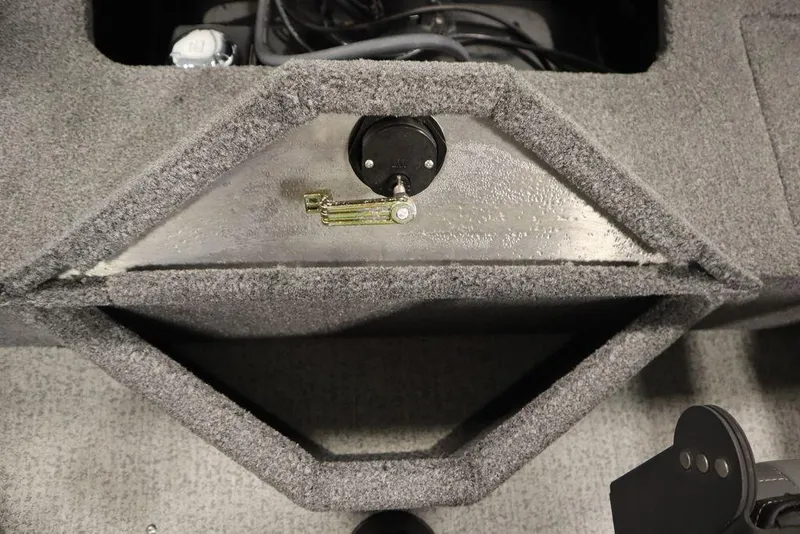 Slide: The Image of 2023 Tracker Pro Guide V-16 WT boat interior with carpeted storage compartment. - 47