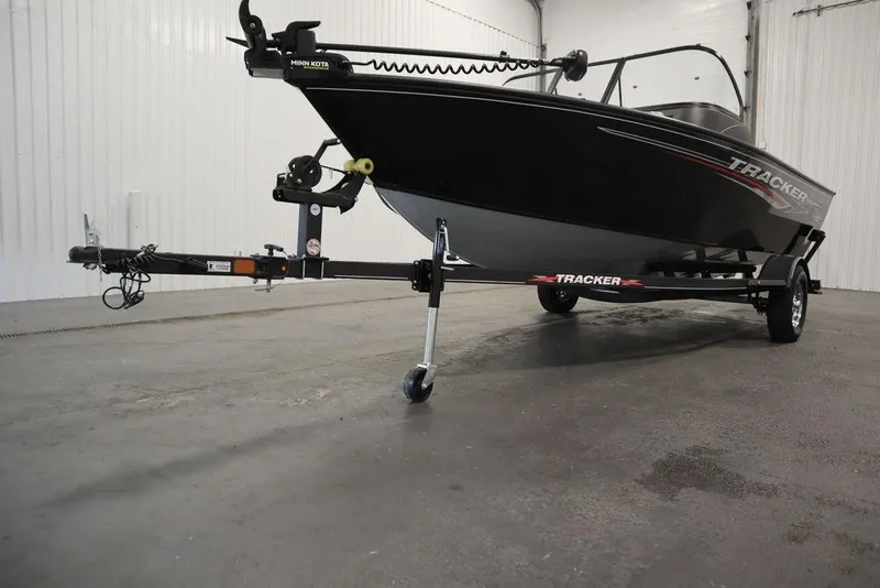 Slide: The Image of 2023 Tracker Pro Guide V-16 WT boat on trailer in indoor setting. - 54