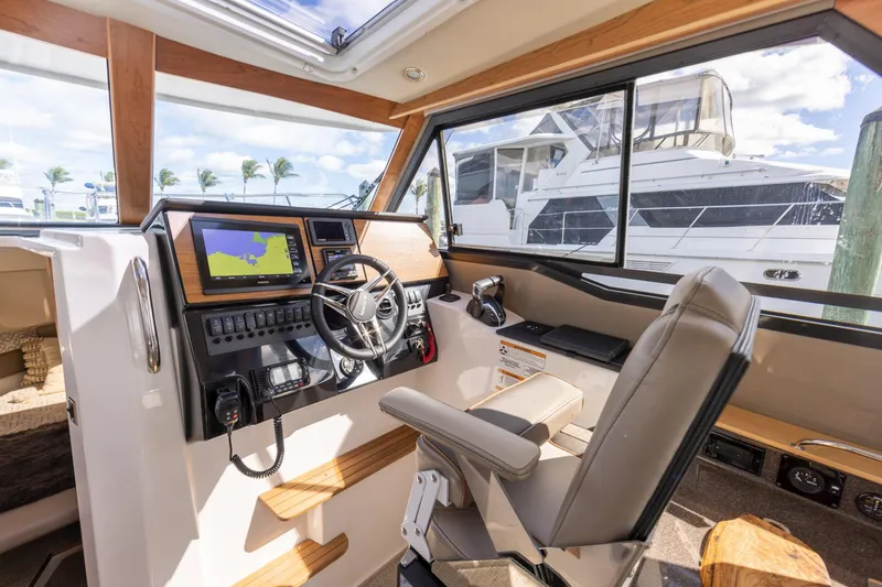 Slide: The Image of Interior of 2026 Cutwater C-288 C boat with modern helm and navigation system. - 6