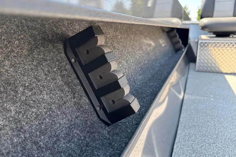 Slide: The Image of 2026 Fish Rite Angler 18 interior detail with rod holder and seating. - 11