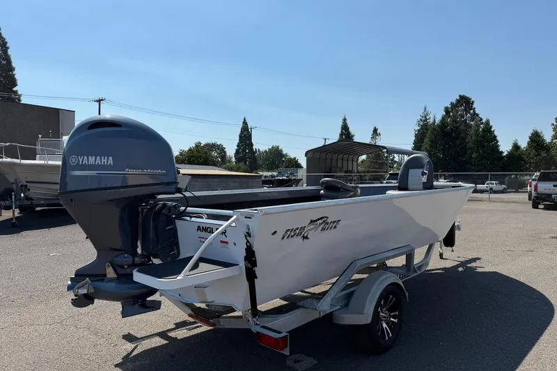 Slide: The Image of 2026 Fish Rite Angler 18 boat with Yamaha outboard motor in parking lot. - 3