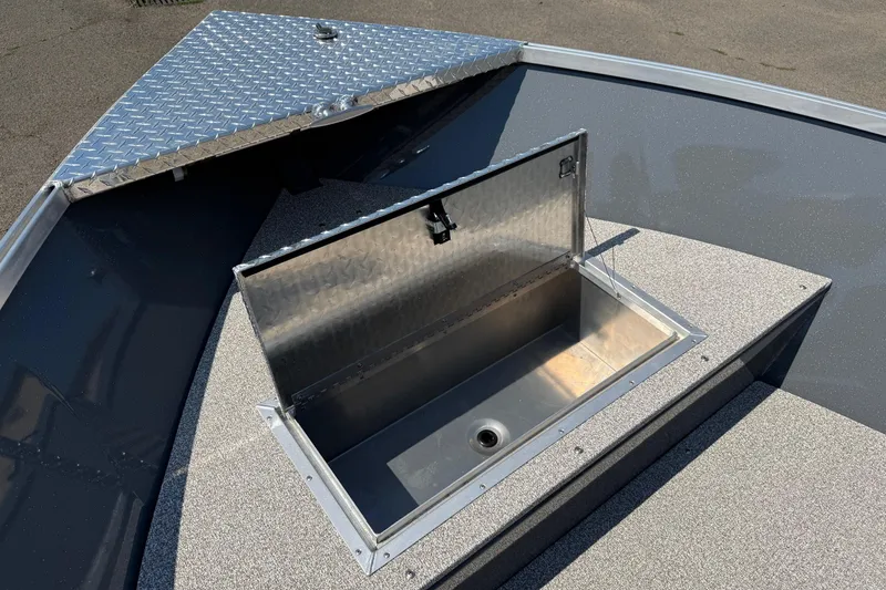 Slide: The Image of 2026 Fish Rite Angler 18 boat with open storage compartment on deck. - 6