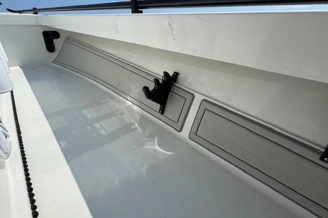 Slide: The Image of 2024 Beavertail Skiffs Vengeance interior detail with rod holder and sleek design. - 10