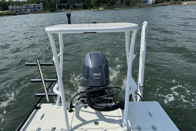 Slide: The Image of 2024 Beavertail Skiffs Vengeance boat with Yamaha 90 engine on open water. - 11