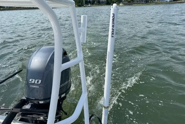 Slide: The Image of 2024 Beavertail Skiffs Vengeance with Yamaha 90 engine on water, featuring Power-Pole anchor. - 14