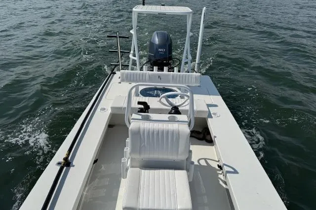 Slide: The Image of 2024 Beavertail Skiffs Vengeance on water, showcasing sleek design and powerful engine. - 18