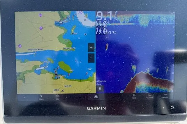 Slide: The Image of Garmin navigation display on 2024 Beavertail Skiffs Vengeance, showing map and sonar data. - 2