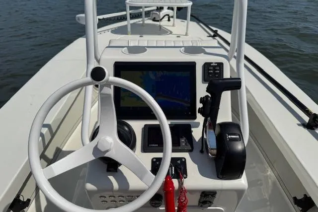Slide: The Image of 2024 Beavertail Skiffs Vengeance boat console with steering wheel and navigation system. - 4