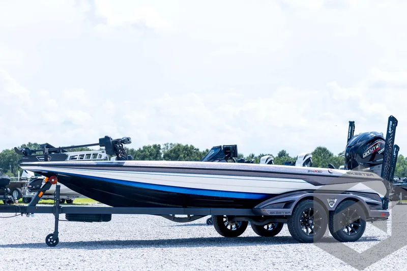 The Image of 2026 Skeeter FXR21 FLEX boat on trailer, side view, outdoors. - 1
