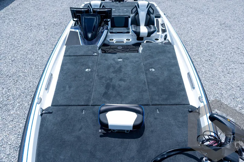 Slide: The Image of 2026 Skeeter FXR21 FLEX boat interior with seating and control panel. - 10