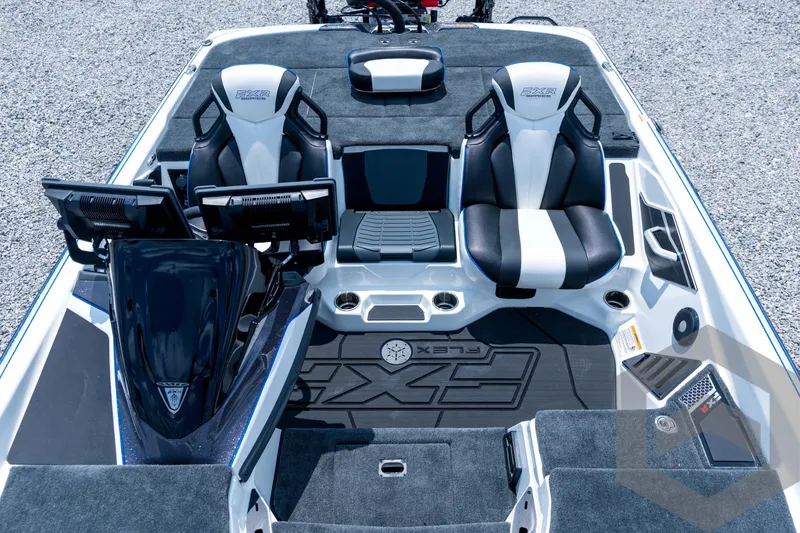 Slide: The Image of 2026 Skeeter FXR21 FLEX boat interior with dual seats and advanced dashboard. - 12