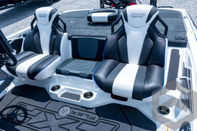 Slide: The Image of 2026 Skeeter FXR21 FLEX boat interior with dual black and white seats. - 13