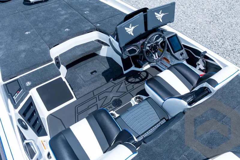 Slide: The Image of 2026 Skeeter FXR21 FLEX boat interior with dual screens and modern seating. - 14