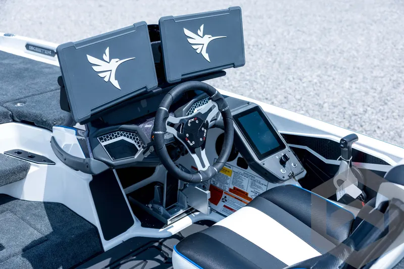 Slide: The Image of 2026 Skeeter FXR21 FLEX boat cockpit with dual screens and modern steering wheel. - 17
