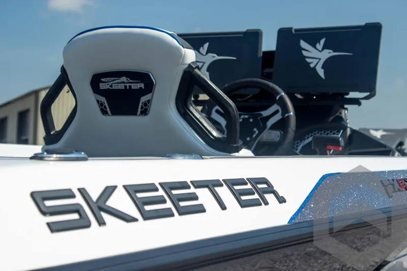 Slide: The Image of 2026 Skeeter FXR21 FLEX boat interior with logo and steering wheel. - 24