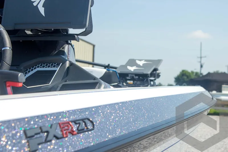 Slide: The Image of 2026 Skeeter FXR21 FLEX boat detail with glitter finish and logo. - 25