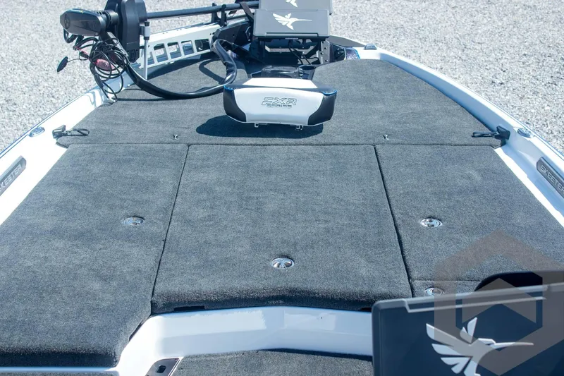 Slide: The Image of 2026 Skeeter FXR21 FLEX boat deck with advanced fishing equipment and carpeted surface. - 27