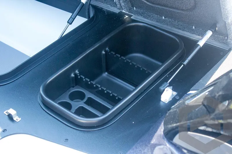 Slide: The Image of 2026 Skeeter FXR21 FLEX boat storage compartment with organized interior layout. - 32