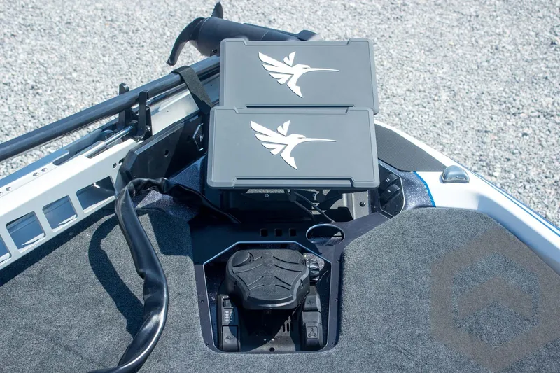 Slide: The Image of 2026 Skeeter FXR21 FLEX boat dashboard with dual electronic displays. - 33