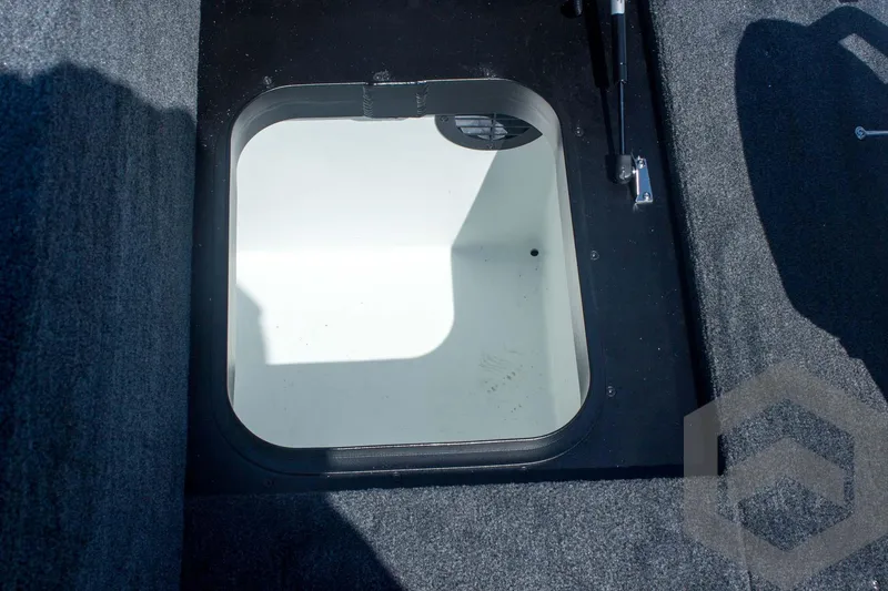 Slide: The Image of Open storage compartment in 2026 Skeeter FXR21 FLEX boat. - 43
