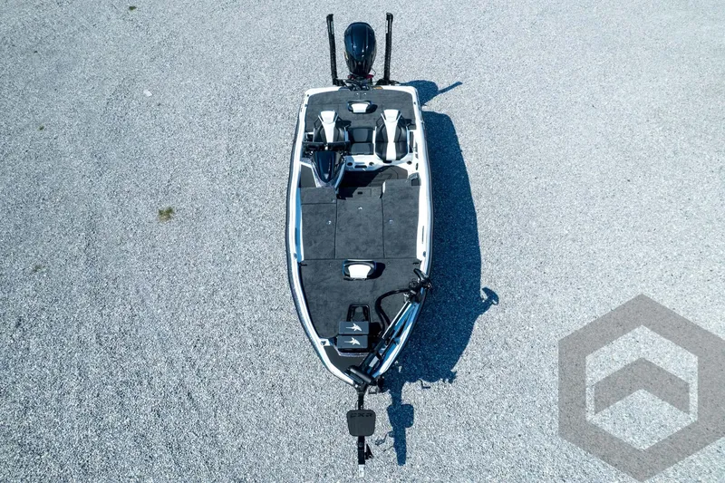 Slide: The Image of 2026 Skeeter FXR21 FLEX boat on gravel surface, aerial view. - 49