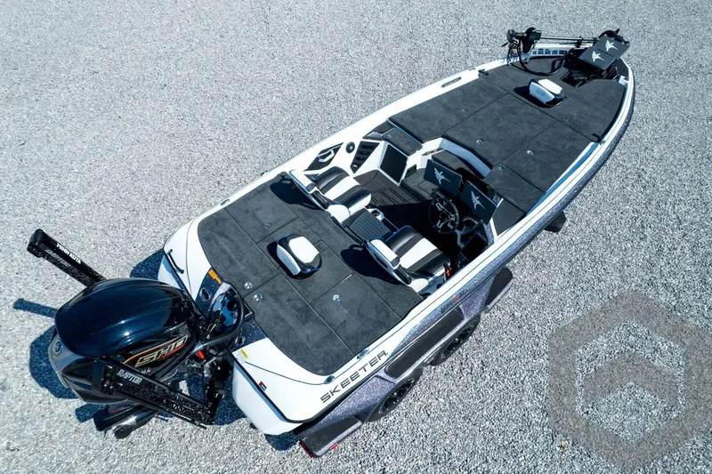 Slide: The Image of 2026 Skeeter FXR21 FLEX boat with sleek design on gravel surface. - 52