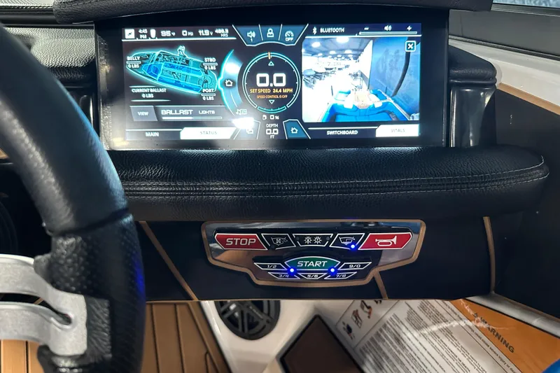 Slide: The Image of Dashboard of 2018 Nautique Super Air Nautique GS24 with digital controls and display. - 18