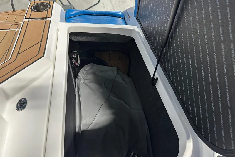 Slide: The Image of Open storage compartment in 2018 Nautique Super Air Nautique GS24 boat. - 20