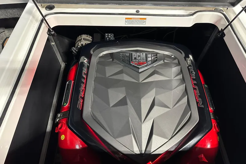 Slide: The Image of 2018 Nautique Super Air Nautique GS24 engine compartment with PCM cover. - 22
