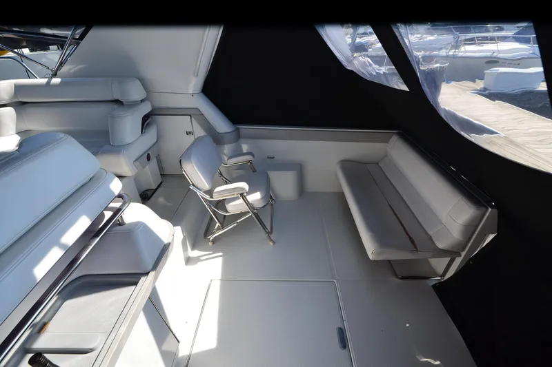 Slide: The Image of Interior of 1991 Baron 43-E yacht with white seating and modern design. - 10