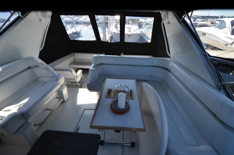 Slide: The Image of Luxurious interior of 1991 Baron 43-E yacht with white seating and table. - 12