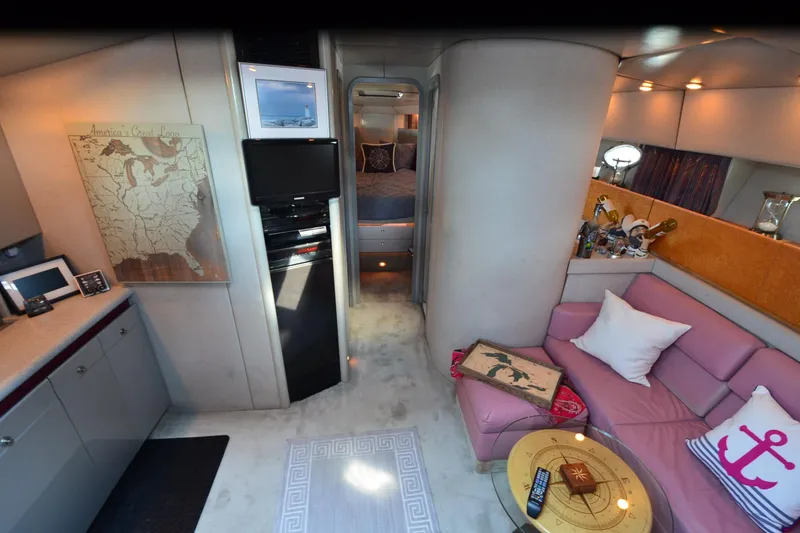 Slide: The Image of Luxurious interior of a 1991 Baron 43-E yacht with cozy seating and nautical decor. - 15