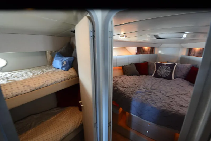 Slide: The Image of Interior of 1991 Baron 43-E yacht with cozy bunk beds and a spacious double bed. - 20