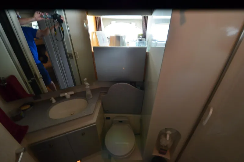 Slide: The Image of Compact bathroom interior of a 1991 Baron 43-E aircraft, featuring sink and toilet. - 27
