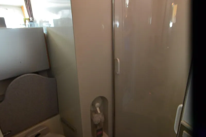 Slide: The Image of Interior of a 1991 Baron 43-E aircraft bathroom with shower and sink. - 28