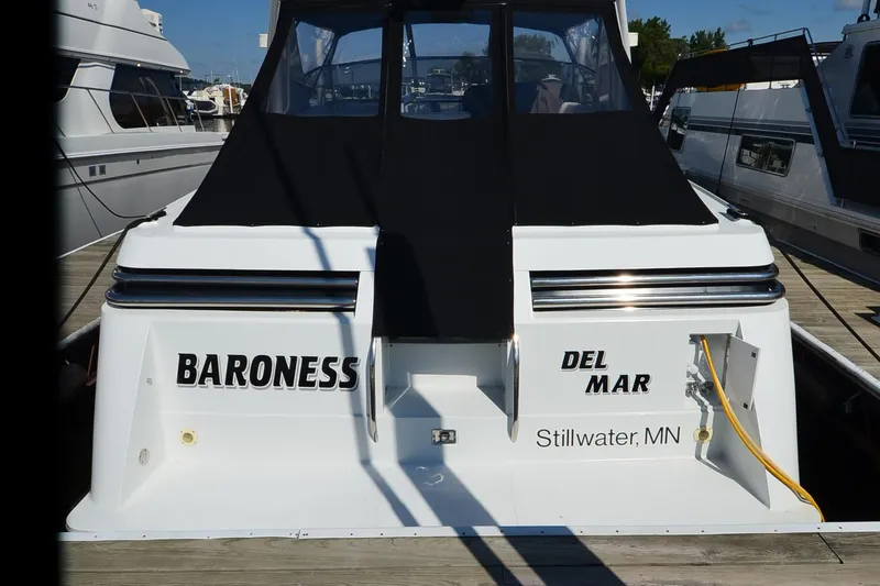 Slide: The Image of 1991 Baron 43-E yacht "Baroness" docked in Stillwater, MN, with black canopy. - 3