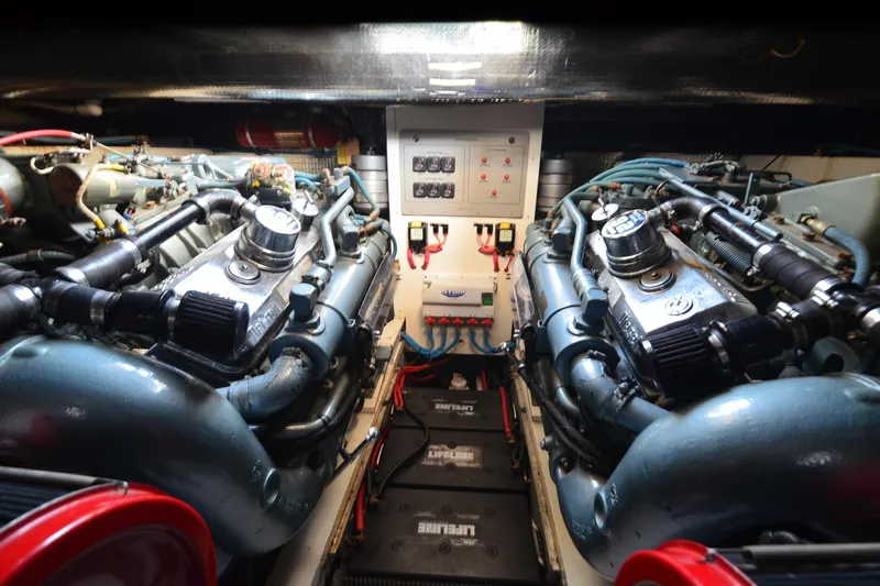 Slide: The Image of Engine room of a 1991 Baron 43-E boat, featuring dual engines and control panel. - 30