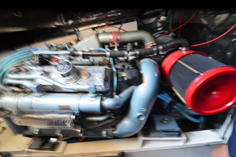 Slide: The Image of Engine of a 1991 Baron 43-E with visible red air filter and blue hoses. - 32
