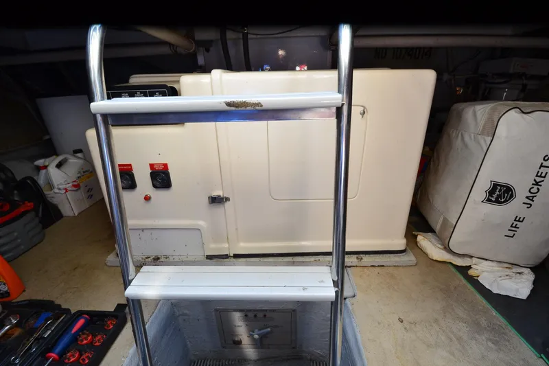 Slide: The Image of Interior of a 1991 Baron 43-E boat showing equipment and life jackets. - 35