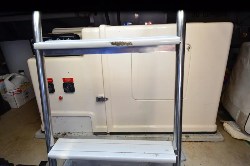 Slide: The Image of Engine room of 1991 Baron 43-E with control panel and ladder. - 36