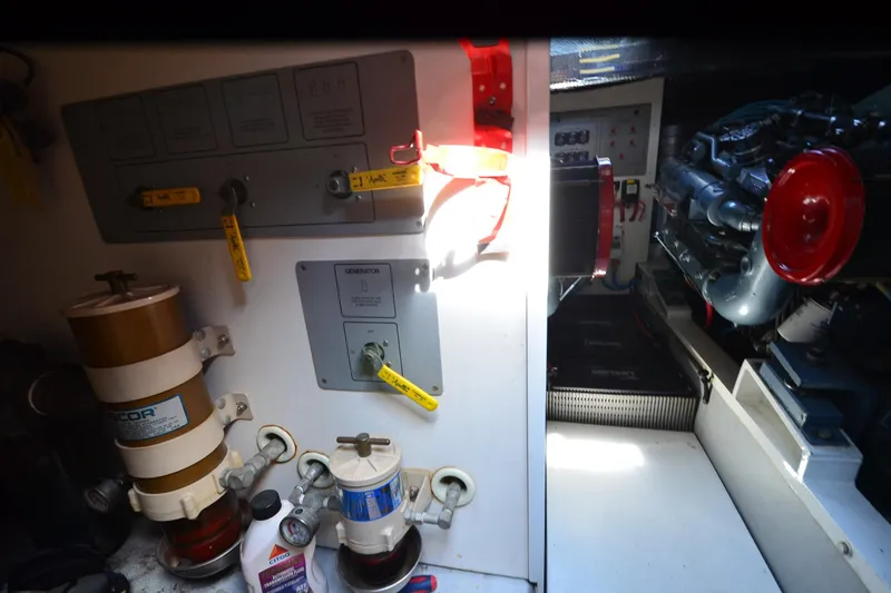 Slide: The Image of Engine room of 1991 Baron 43-E with filters, controls, and machinery components. - 39