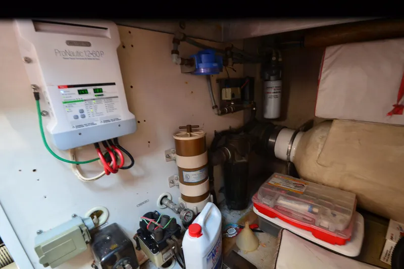 Slide: The Image of Engine room of a 1991 Baron 43-E with electrical and mechanical components. - 40