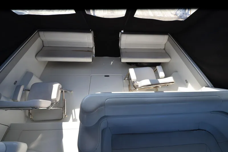 Slide: The Image of Spacious interior of 1991 Baron 43-E boat with white seating and modern design. - 7