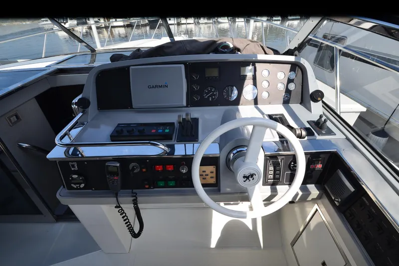 Slide: The Image of Cockpit of 1991 Baron 43-E boat with Garmin navigation system and control panel. - 9