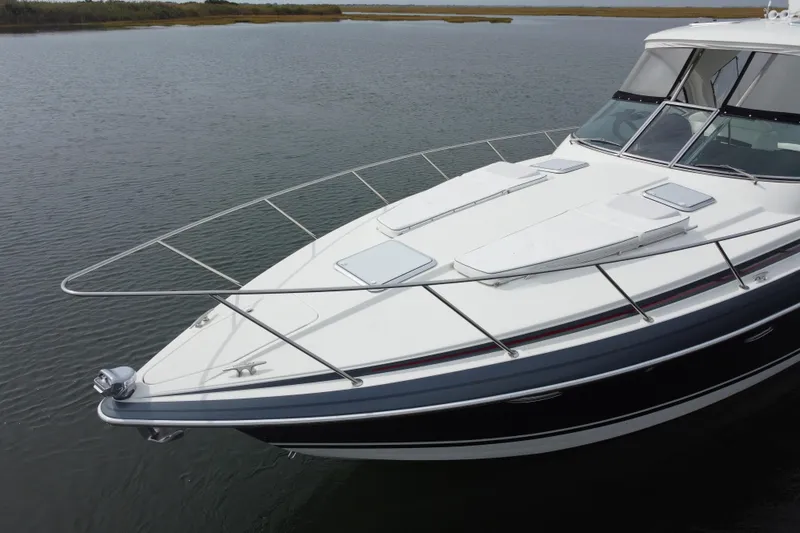 Slide: The Image of 2017 Formula 37 Performance Cruiser on calm water, showcasing sleek design and modern features. - 11