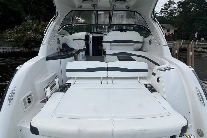 Slide: The Image of 2017 Formula 37 Performance Cruiser interior with sleek seating and modern helm on calm water. - 15