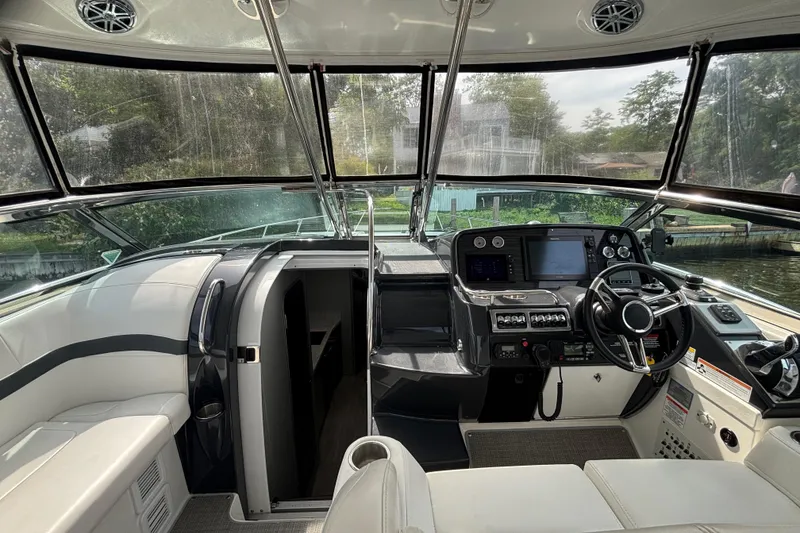 Slide: The Image of 2017 Formula 37 Performance Cruiser on calm waters, featuring sleek design and spacious seating. - 19